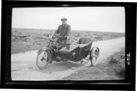 A Taylor on motorcycle with sidecar