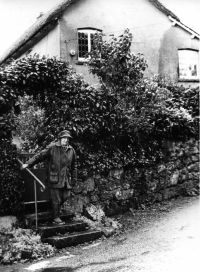 Sue Smith outside a house