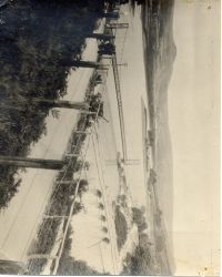 Work on enlarging the Burrator reservoir, showing the suspension bridge which carried traffic to She