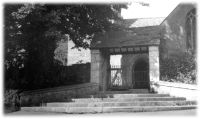 The lych gate and steps at the entrance to Lustleigh Parish Church