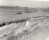 The remaining water channel at Fernworthy Reservoir during the drought of 1959