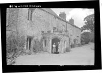 Women in porch of Weare Giffard Hall