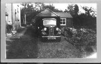 Old Austin in front of garage at Manaton