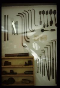 Tools used at Glass's Iron Foundry displayed in a glass cabinet