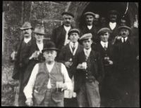 Group drinking on steps of Oxenham Arms 