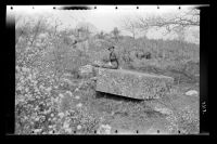 Marjorie posing on a stone at Heckwood