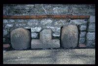 Cross and boundary stones set in wall at Sungates in Plymouth