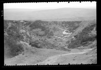 Tin mining earthworks forming part of the bank of Crazy Well Pool