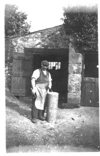 The village blacksmith outside the forge