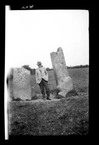 A Taylor on the moor between two stones (The King Doniert Stone) Cornwall