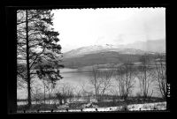 Sheeps Tor in the snow with Burrator Reservoir in the foreground.