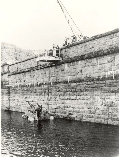 Royal Naval divers working on a  jammed valve at the Burrator Reservoir