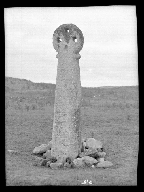 Cross with circular head with holes in it