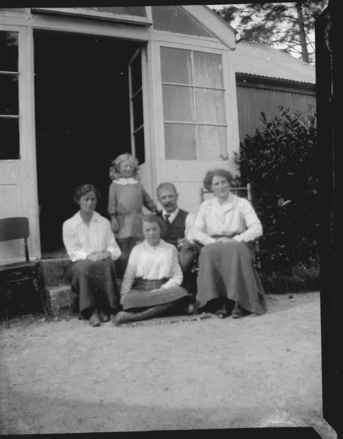 The Ruse family and Mrs Horton on the steps of the "music room", Brimpts Farmhouse