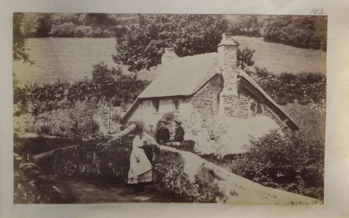 Woman and two girls on a bridge