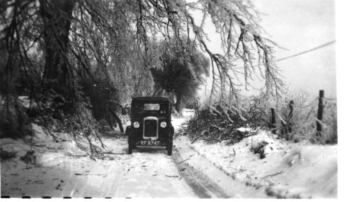 The Clements Delivering Newspapers in Their Austin 7 During the Great Blizzard of 1947