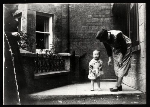 Rosemary Wonnacott & Nellie Lee outside Endacott's baker's shop