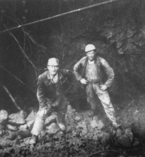 Miners standing inside rediscovered mineworkings at Kelly Mine