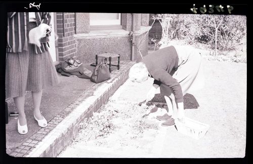 Marjorie Taylor and Shirley (?) gardening outside Gratton, Yelverton