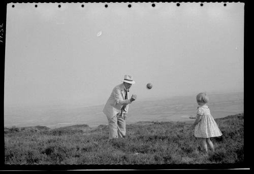 Shirley Taylor and her grandfather (?) playing ball