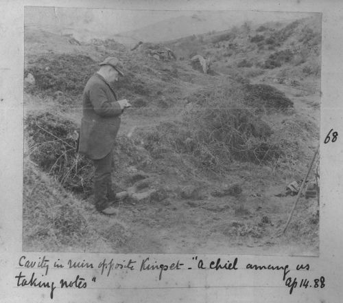 Robert Burnard standing in a ruin near Kingsett farm