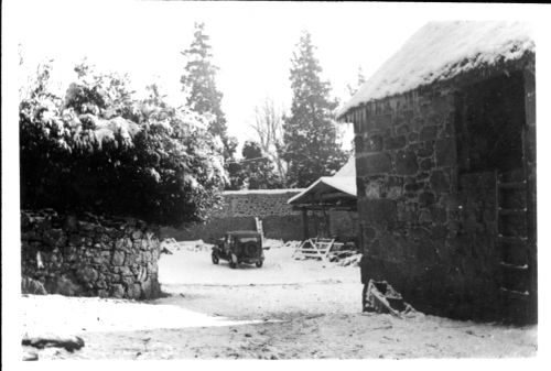 Snow at Manaton, with old car and barn