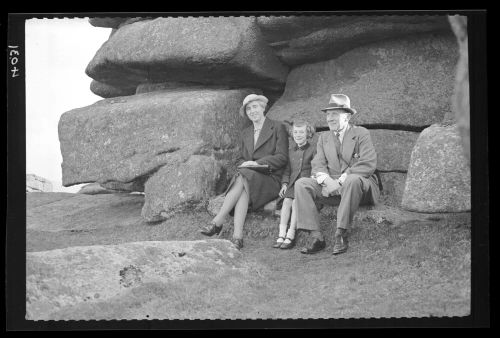 The Taylor family sitting on Pew Tor